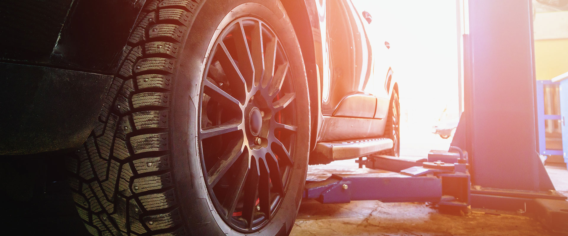 Car on a ramp with tyre in focus